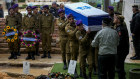 Israeli soldiers carry the flag-draped casket of Staff Sergeant Birhanu Kassie during his funeral in Jerusalem on Sunday. Kassie, 22, was killed during Israel’s ground operation in the Gaza Strip.
