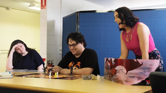 Autism Queensland Dungeons & Dragons program participant Elissa Pirnie, program mentor David Smith and Lead Occupational Therapist Caitlin Taggart.