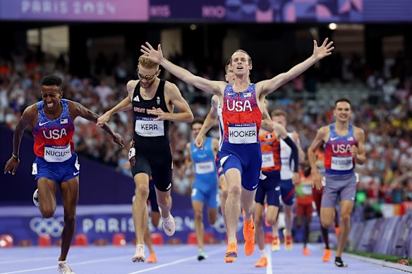 Bronze medalist Yared Nuguse of Team United States , silver medalist Josh Kerr of Great Britain, gold medalist Cole Hocker of United States amnd Jakob Ingebrigtsen of Norway cross the finish line during the Men’s 1500m Final