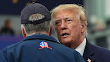 President Donald Trump talks with Sen. Dan Sullivan at a campaign event earlier this month.