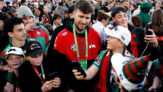 Jai Arrow is mobbed by Rabbitohs fans.