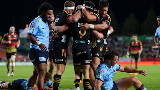 The Chiefs celebrate a try against the Waratahs on Saturday.