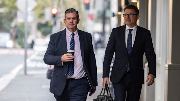 Witness Martin Berry (left) arrives at the Independent Commission Against Corruption after lunch on Friday.