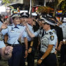 NSW Police Commissioner Karen Webb (centre) marches with colleagues in the 2023 Mardi Gras parade.