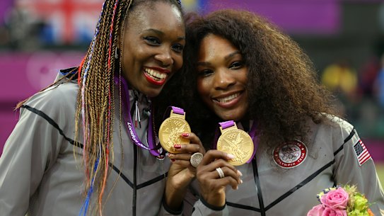 Serena with sister Venus after winning the doubles at the London Olympics in 2012.