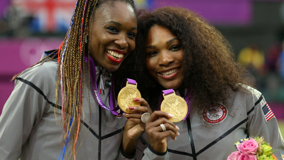 Serena with sister Venus after winning the doubles at the London Olympics in 2012.