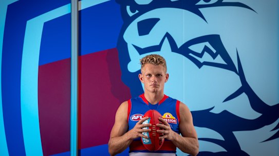 Adam Treloar poses for a photo in his new team colours.