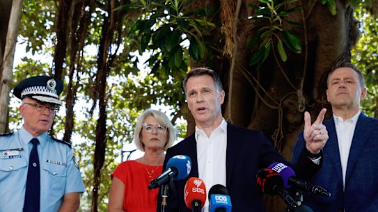 NSW Premier Chris Minns speaks to reporters, flanked by Police Commissioner Mal Lanyon, Minister for Police and Counter-terrorism Yasmin Catley, and Minister for Jobs and Tourism Steve Kamper.