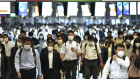 Commuters wearing face masks during rush hour at Shinagawa Station, Tokyo.