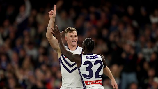 MELBOURNE, AUSTRALIA - AUGUST 24: Josh Treacy of the Dockers is congratulated by Michael Frederick after kicking a goal during the round 24 AFL match between Western Bulldogs and Fremantle Dockers at Marvel Stadium on August 24, 2025 in Melbourne, Australia. (Photo by Robert Cianflone/Getty Images)