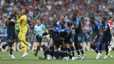 French players celebrate at the end of the match.