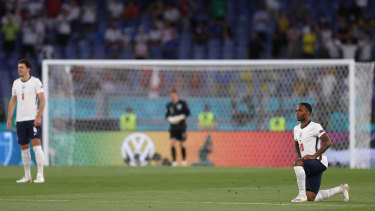 England player Raheem Sterling takes the knee during England’s match against Ukraine.