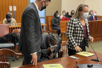 Anthony Broadwater (centre) breaks down crying on November 22, 2021, when a New York judge overturned his 40-year-old rape conviction. 