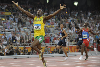 Jamaica’s Usain Bolt celebrates as he wins the men’s 200-meter final with a world record during the athletics competitions in the National Stadium at the Beijing 2008 Olympics in Beijing, Wednesday, Aug. 20, 2008. 