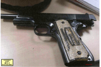 The diamond-encrusted pistol, monogrammed with his initials JGL - Joaquin Guzman Loera.