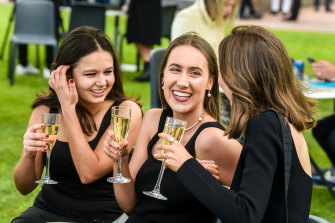 Race guests enjoy a drink in Flemington on Derby Day.