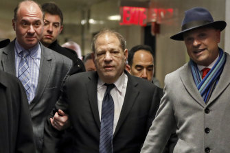 Harvey Weinstein, centre, is accompanied by attorney Arthur Aidala, right, as he arrived at court for his trial.