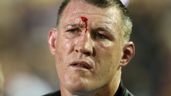 Rotten night at the office: Paul Gallen watches from the sideline in his last NRL game.