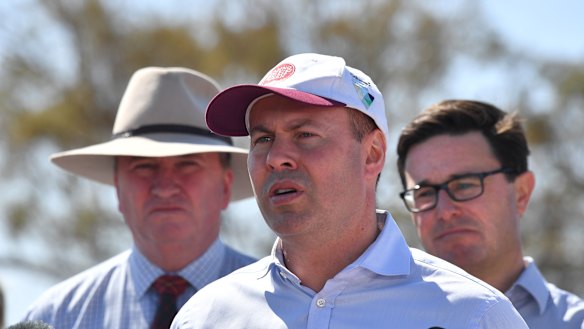 Josh Frydenberg, centre, former deputy prime minister Barnaby Joyce, left, and Drought Minister David Littleproud in Inverell yesterday.