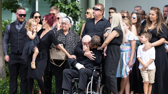 Friends and family are seen at a funeral service for Ashley Jenkinson at Southport Church of Christ on the Gold Coast.