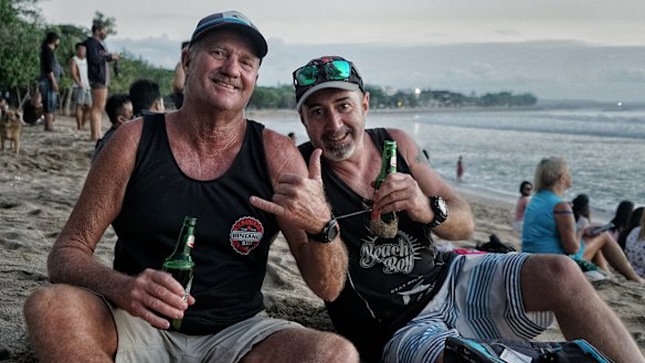 Tim Ryan, right, and Paul Sage at Kuta beach in Bali after it reopened.
