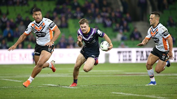 Flyin' Ryan: Melbourne's first tryscorer Ryan Papenhuyzen hits a gap.