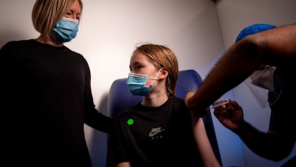 Twelve-year-old Eve, accompanied by her mum Narelle, having her first coronavirus vaccination in Melbourne last week.