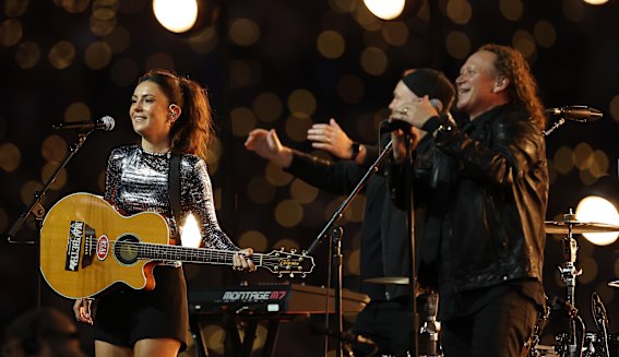 Amy Shark and Dave Gleeson perform before the NRL grand final.