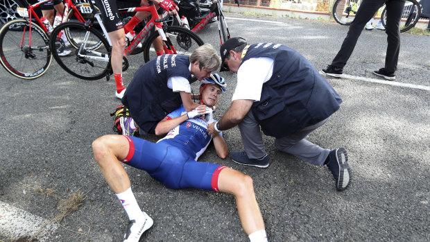 Netherlands' Niki Terpstra receives medical attention after crashing during the eleventh stage.