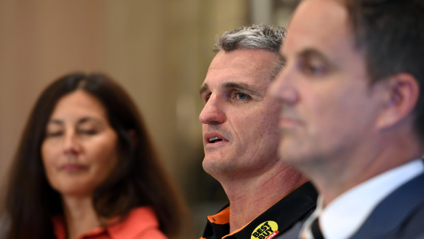Getting off the bus: West Tigers chair Marina Go and CEO Justin Pascoe with Ivan Cleary.