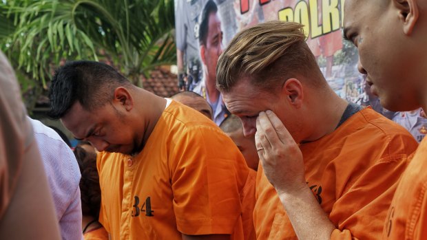 William Cabantog, left, and David Van Iersel during a press conference at Denpasar police station.