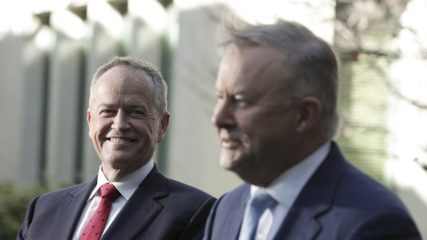 Opposition Leader Anthony Albanese (right) speaks in June with the man he replaced as Labor leader, Bill Shorten.
