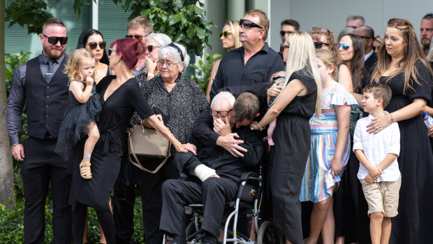 Friends and family are seen at a funeral service for Ashley Jenkinson at Southport Church of Christ on the Gold Coast.