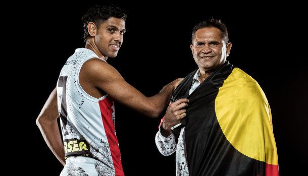 Young Saint Nasiah Wanganeen-Milera (left) with St Kilda great Nicky Winmar.