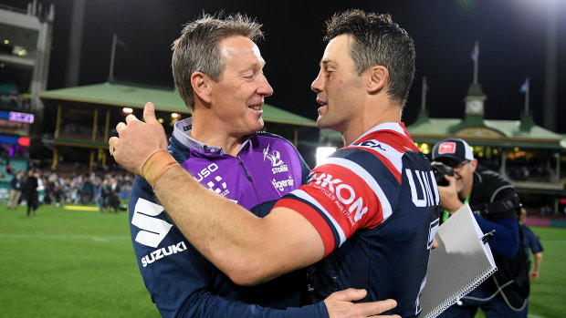 Craig Bellamy and Cooper Cronk embrace after the Roosters knocked the Storm out last week.