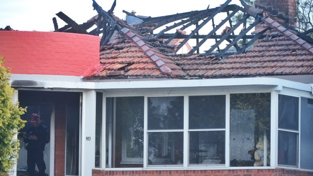 A man died after re-entering a house at Rodd Point to battle a fire. 
