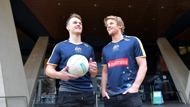 Rory Sloane (right) and Robbie Gray promote the hybrid rules series in 2017.