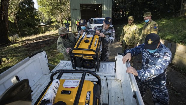 Troops prepare to distribute generators to residents in the storm-ravaged Dandenong Ranges.