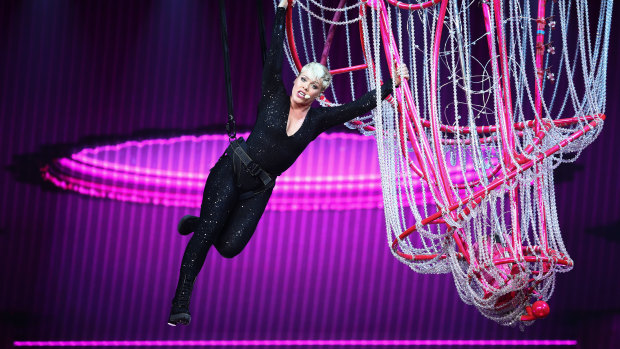 Pink swings from the chandelier in her show in Sydney on Saturday.
