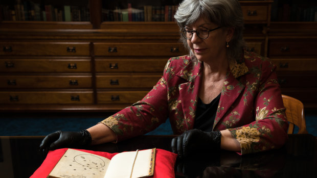 Maggie Patton, chief curator at the  State Library of NSW, with a 1516 letter containing a drawing of the Southern Cross, thought to be the oldest European depiction. 