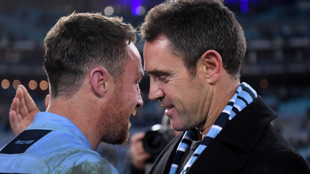 Reunited and it sort of feels so good ... James Maloney and Brad Fittler after winning last year's series.