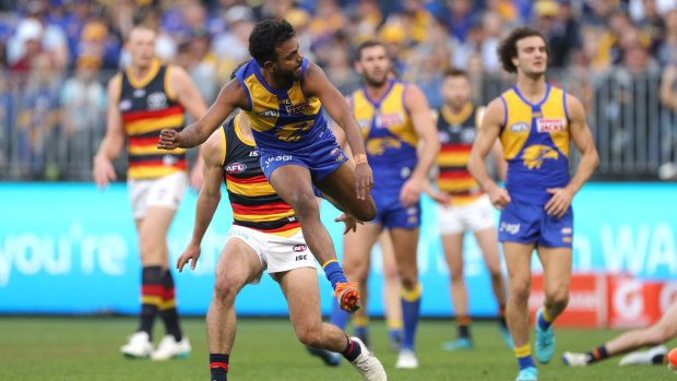 Goal sneak: Willie Rioli boots a major for West Coast.