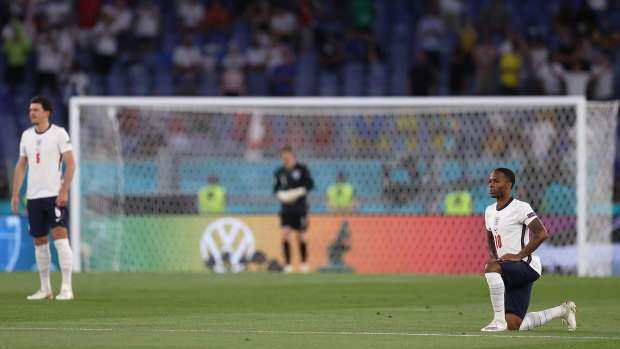 England player Raheem Sterling takes the knee during England’s match against Ukraine.