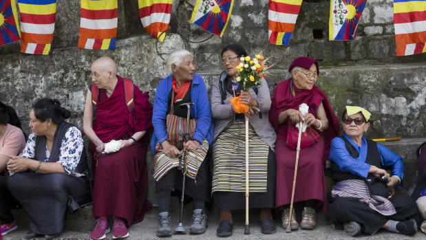 Tibetan and Buddhist flags decorate the streets in Dharmsala, as exiled Tibetans await the return of their spiritual leader.