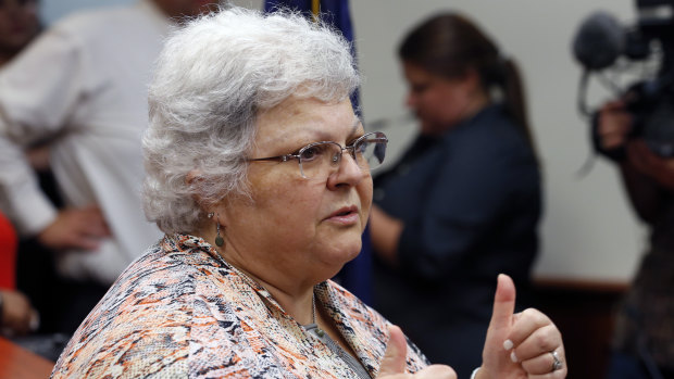 Susan Bro, mother of Heather Heyer who was killed in 2017 during a white supremacist rally, gives a thumbs up to the press after the sentencing of James Alex Fields jnr in federal court in Charlottesville, Virginia.