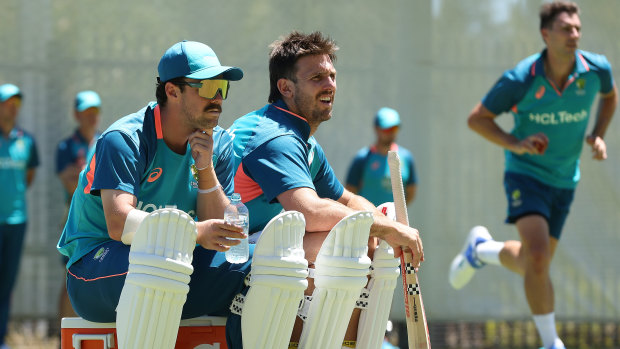 Travis Head and Mitchell Marsh watch on at training during the week.