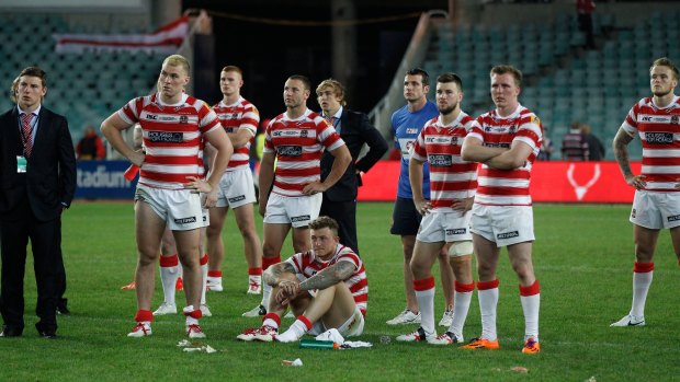 Wigan players following their loss to the Roosters in Sydney in 2014.