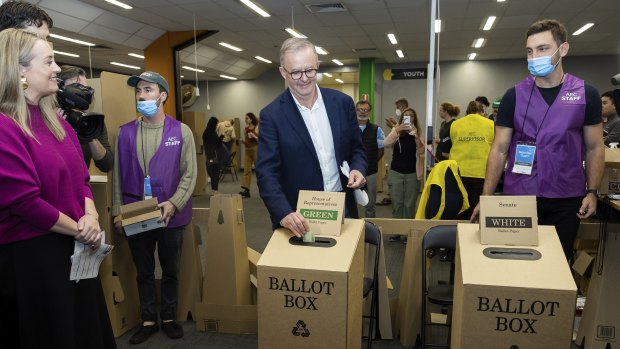 Anthony Albanese (centre) voting with partner Jodie Haydon at the 2022 federal election. Much has changed since he cast his vote.