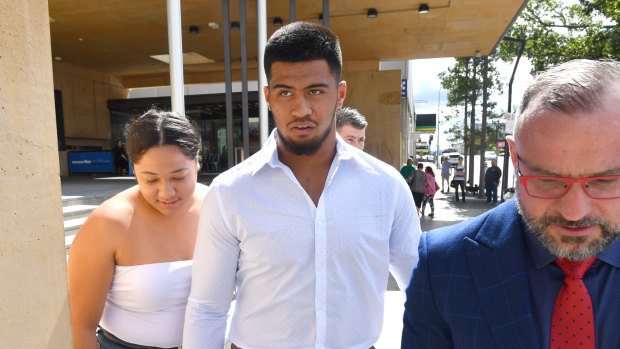Brisbane Broncos player Payne Haas (centre) leaving the Ipswich Magistrates Court.