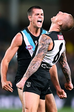 Port Adelaide’s Ryan Burton and Hamish Hartlett.